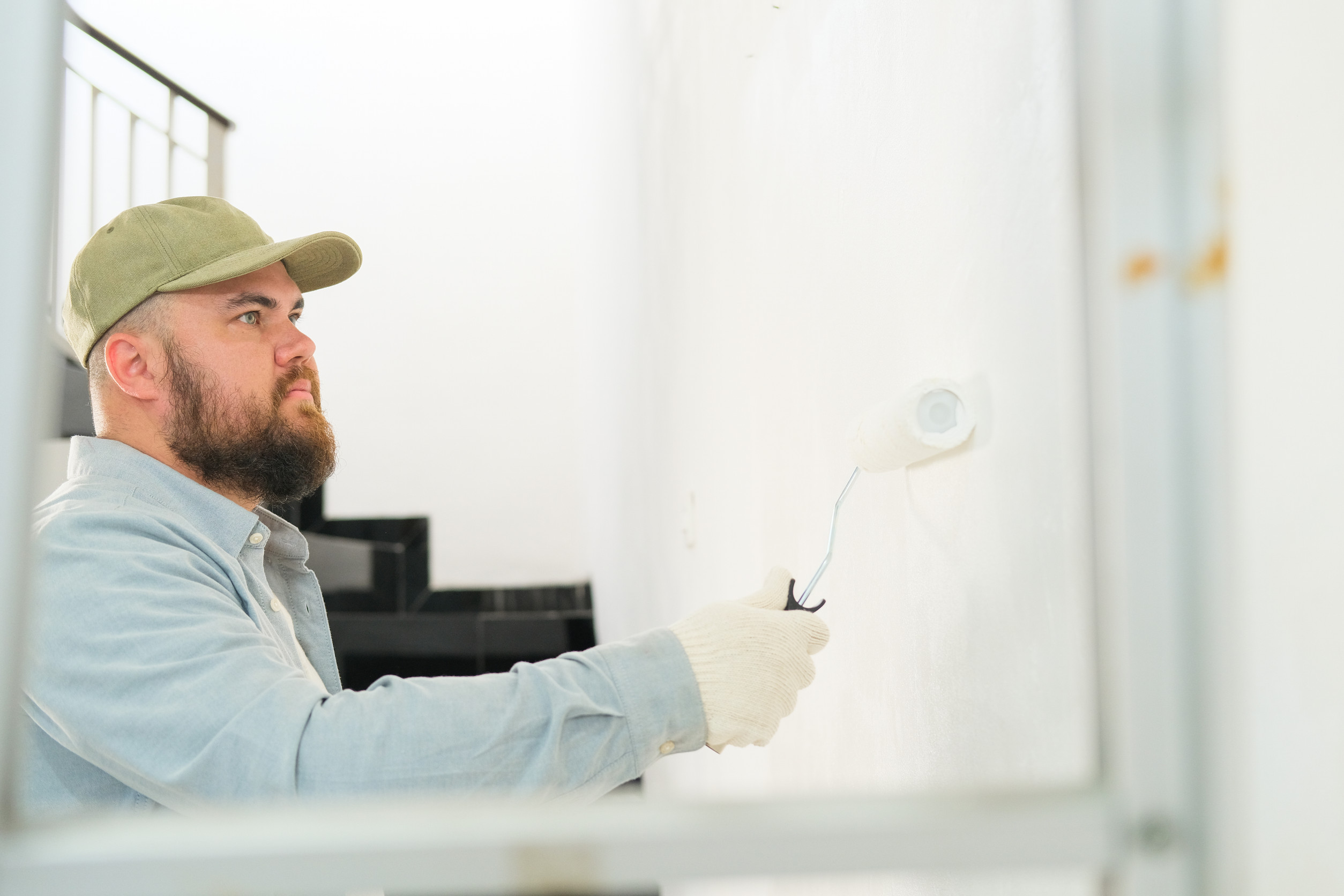 professional painter painting wall